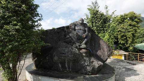 Monkey statue at the entrance of Adyanpara Waterfalls