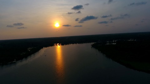 Aerial shot of a water body reflecting the sun