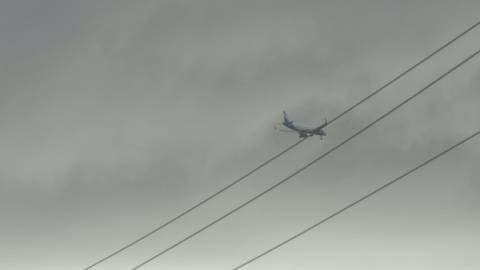 Aeroplane passing through the monsoon sky