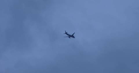 Aeroplane disappearing into the Clouds