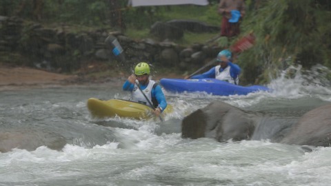 Athletes participating in kayaking competition