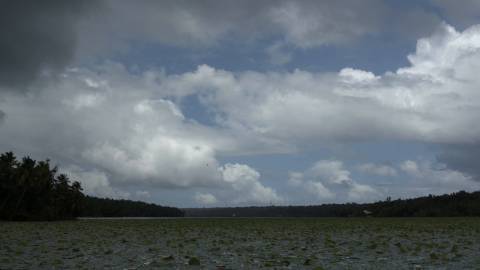 Clouds moving across blue sky