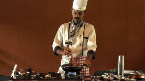 Chef cooking a Kerala cuisine