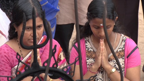 Devotees pray at Ochira Temple, Kerala