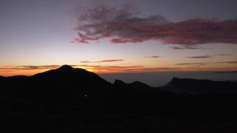 Moving cloud turns red above mountains in Kerala