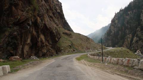 Tracking shot of a winding mountain road, Himalayas, Uttarakhand