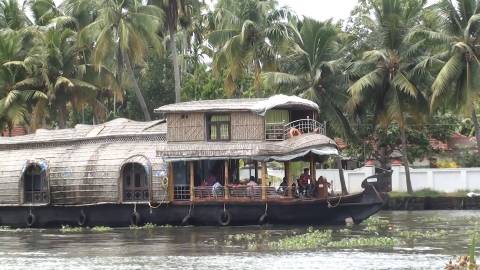 Houseboat cruising through Alappuzha backwaters, Kerala