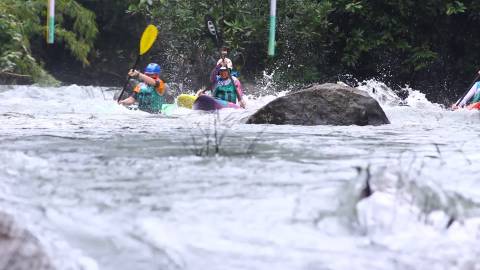 Kayakers paddling across a river, Kayaking competition, Kerala