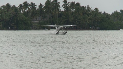 Long shot of a seaplane landing in Kerala