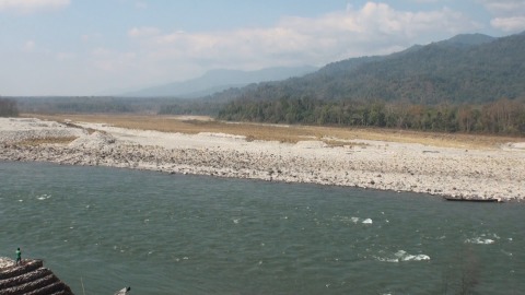 Manas River flows near the foothills of Himalayas