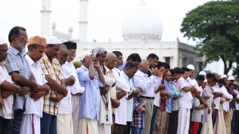 Men offering prayers at the Palyam Juma Masjid