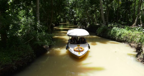 People onboard a boat in a canal