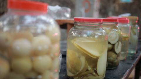 Variety of pickles in glass jars