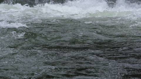 Slow motion video of water gushing down