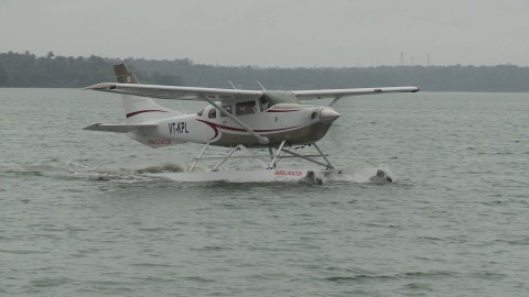 Seaplane floats smoothly on a lake in Kerala