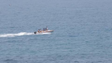 Tourists zipping across Vizhinjam sea in a speed boat