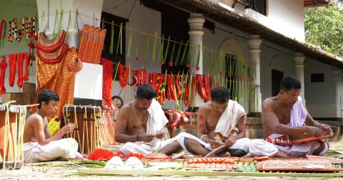 Preparation of costumes for Theyyam performance