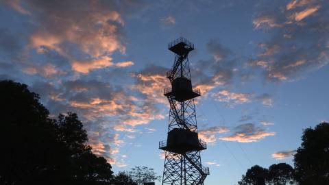 Watchtower silhouette under a colourful evening sky