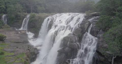 Aerial shot of waterfalls cascading down the rocks, Kerala