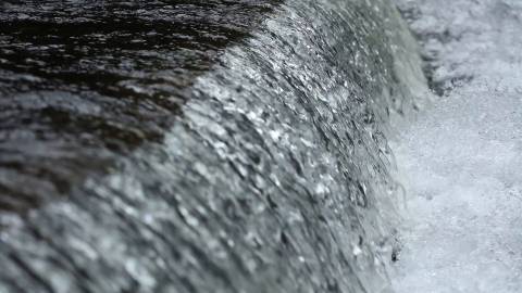 Close up shot of water gushing down